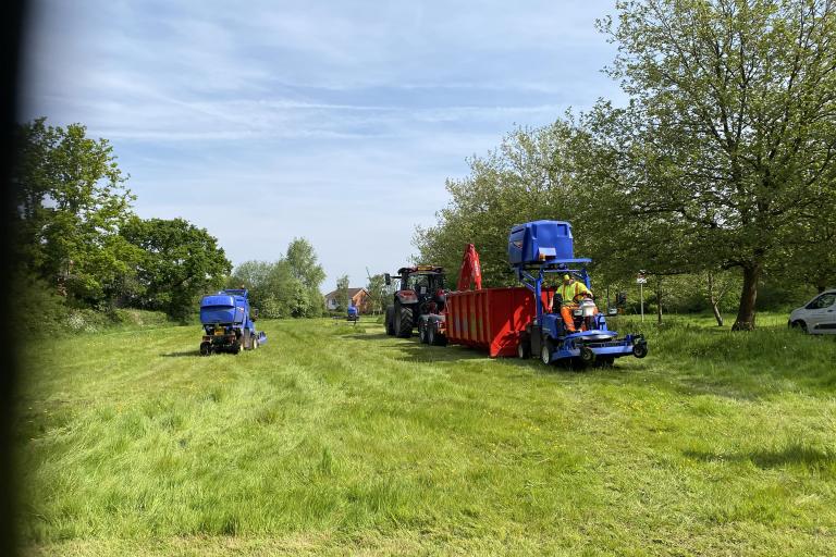 Mowing machines in action 